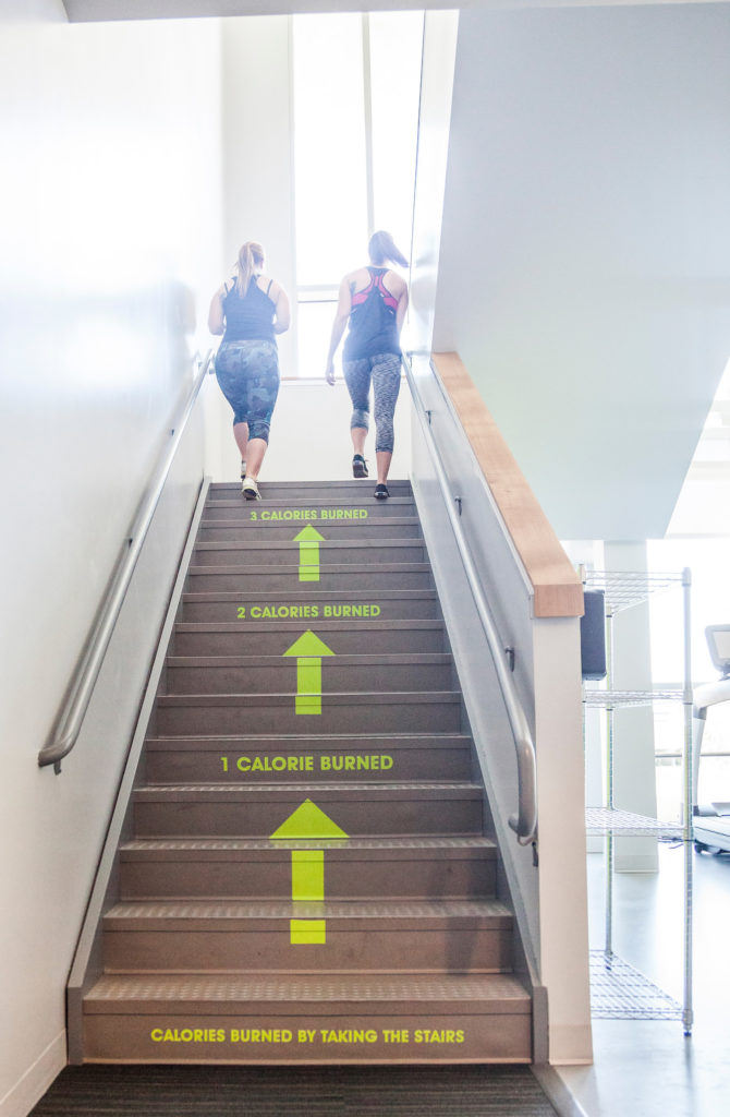 Matt Bambrough - Stairs in the Student Life and Wellness Center on the Utah Valley University campus in Orem, Utah list the number of calories burned by walking, running and texting while taking the stairs, Wednesday, June 17, 2015. (Jay Drowns, UVU Marketing)